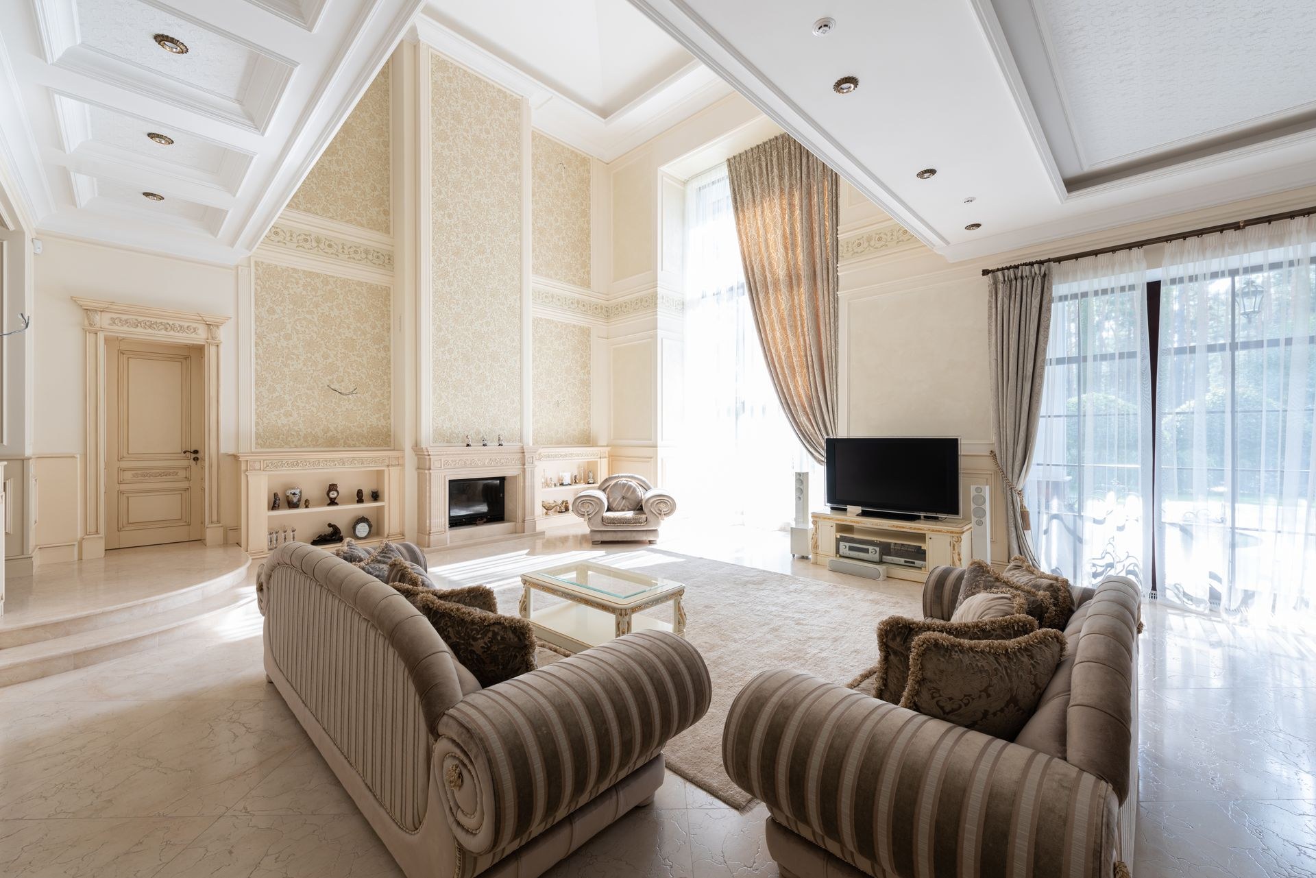 Spacious living room with freshly finished walls and modern furnishings